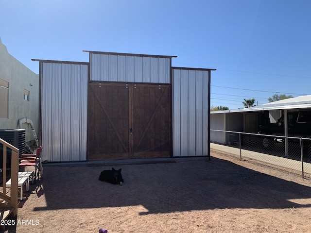 view of outdoor structure with central AC unit