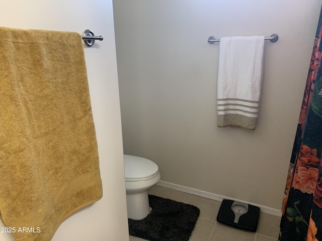 bathroom featuring tile patterned flooring and toilet