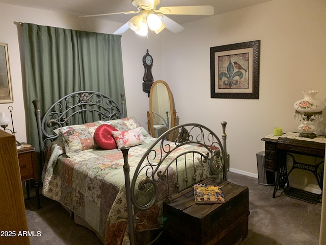 bedroom with ceiling fan and dark colored carpet