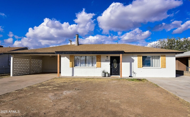 ranch-style home featuring a carport