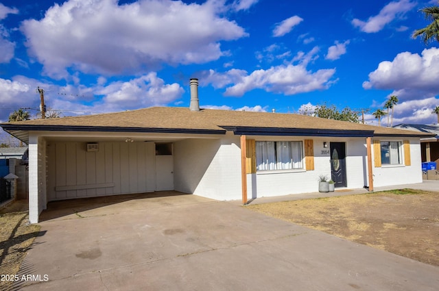 ranch-style home with a carport