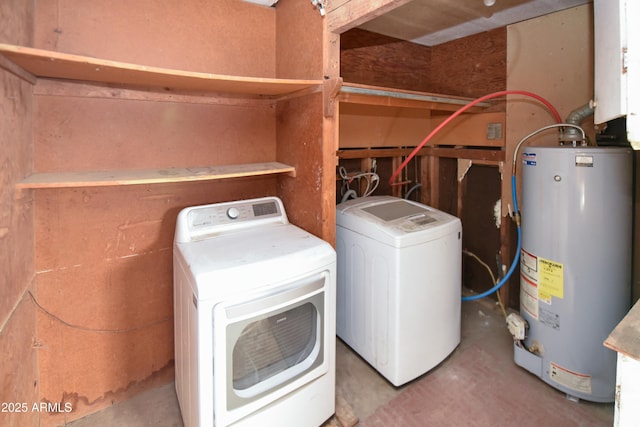 clothes washing area with gas water heater and washer and dryer