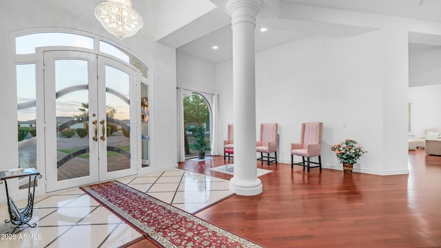 3126 E Fruitvale Ct, Gilbert, AZ 85297 - entryway featuring french doors, ornate columns, a towering ceiling, wood finished floors, and baseboards