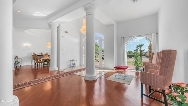 3126 E Fruitvale Ct, Gilbert, AZ 85297 - sitting room with ornate columns, wood finished floors, and a towering ceiling