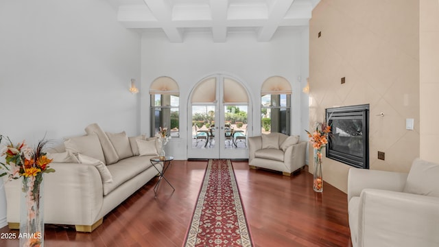 3126 E Fruitvale Ct, Gilbert, AZ 85297 - living area with a towering ceiling, beamed ceiling, french doors, wood finished floors, and a high end fireplace