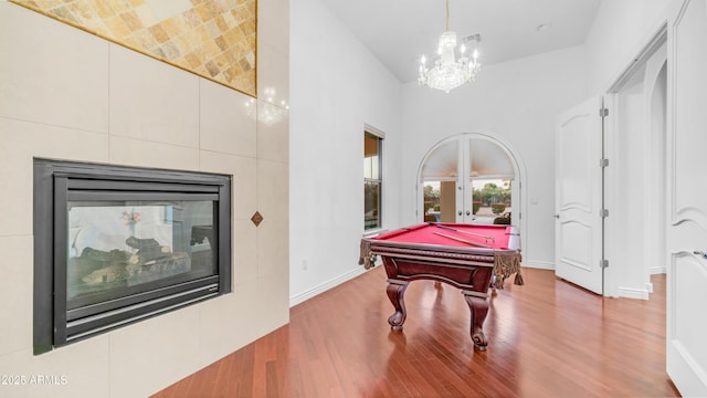 3126 E Fruitvale Ct, Gilbert, AZ 85297 - playroom with wood finished floors, pool table, a chandelier, baseboards, and french doors