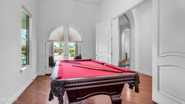 3126 E Fruitvale Ct, Gilbert, AZ 85297 - game room with french doors, arched walkways, wood finished floors, and billiards