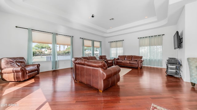 3126 E Fruitvale Ct, Gilbert, AZ 85297 - living area featuring a raised ceiling, wood finished floors, and baseboards