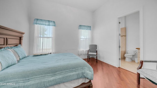 3126 E Fruitvale Ct, Gilbert, AZ 85297 - bedroom with ensuite bath, wood finished floors, and baseboards