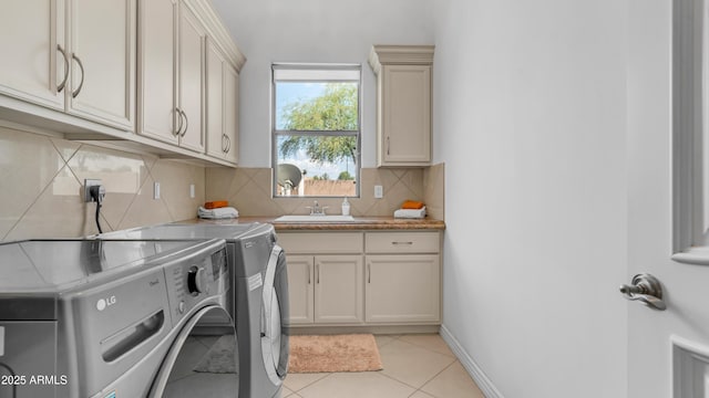 3126 E Fruitvale Ct, Gilbert, AZ 85297 - laundry room featuring washer and clothes dryer, cabinet space, light tile patterned floors, and baseboards