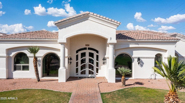 3126 E Fruitvale Ct, Gilbert, AZ 85297 - property entrance with a tiled roof, french doors, and stucco siding