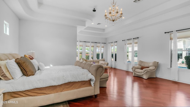 3126 E Fruitvale Ct, Gilbert, AZ 85297 - bedroom featuring wood finished floors, a tray ceiling, a chandelier, and recessed lighting