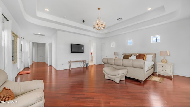 3126 E Fruitvale Ct, Gilbert, AZ 85297 - living room with a tray ceiling, wood finished floors, a chandelier, and recessed lighting