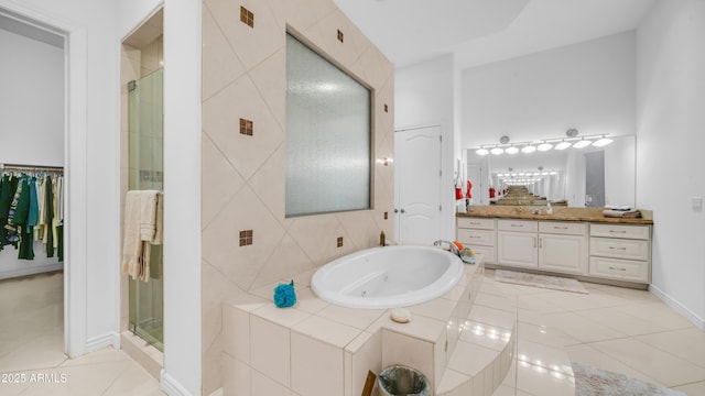 3126 E Fruitvale Ct, Gilbert, AZ 85297 - bathroom with tile patterned flooring, vanity, a tub with jets, a stall shower, and baseboards