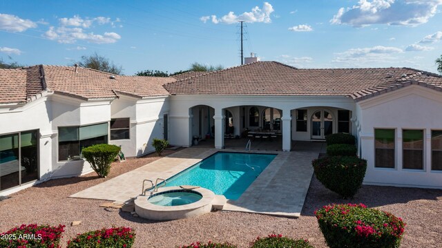 3126 E Fruitvale Ct, Gilbert, AZ 85297 - rear view of house featuring a tile roof, a patio area, a pool with connected hot tub, and stucco siding