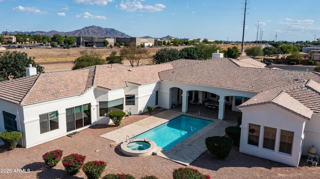 3126 E Fruitvale Ct, Gilbert, AZ 85297 - view of swimming pool with a patio, a pool with connected hot tub, and a mountain view