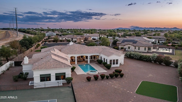 3126 E Fruitvale Ct, Gilbert, AZ 85297 - aerial view at dusk of a residential view and view of pool
