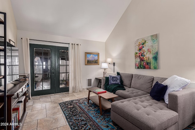 living room with french doors and high vaulted ceiling