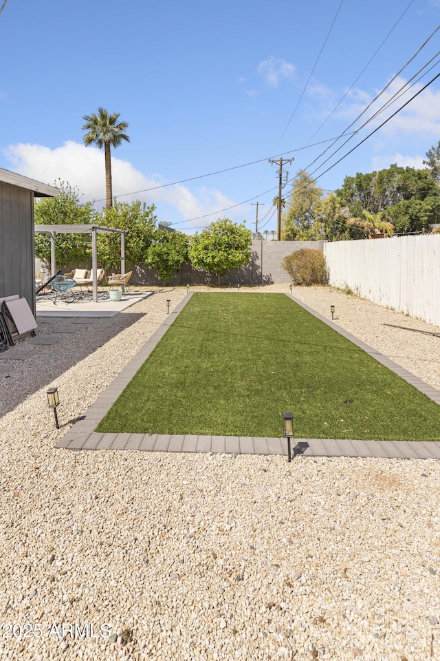 view of yard with a fenced backyard and a patio area