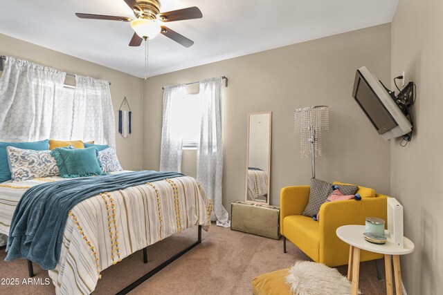 bedroom with a ceiling fan and carpet flooring