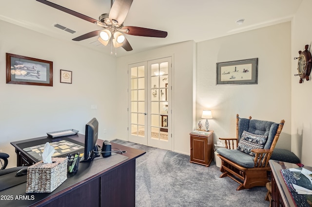 carpeted office with ceiling fan and french doors