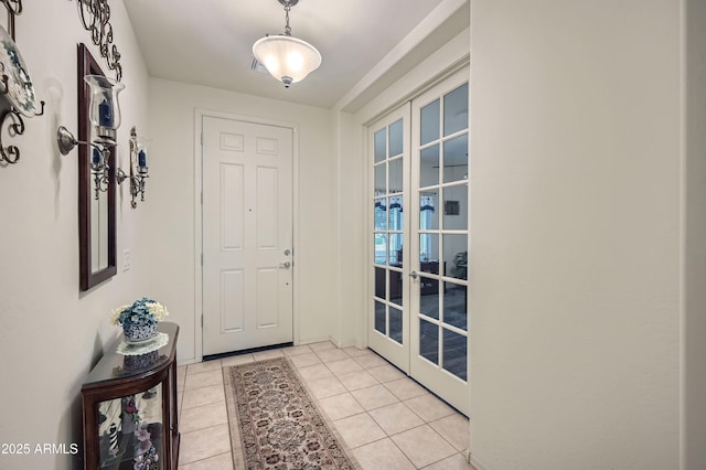 doorway featuring light tile patterned floors and french doors