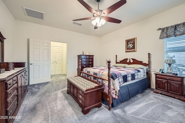 bedroom featuring ceiling fan, a closet, and carpet floors