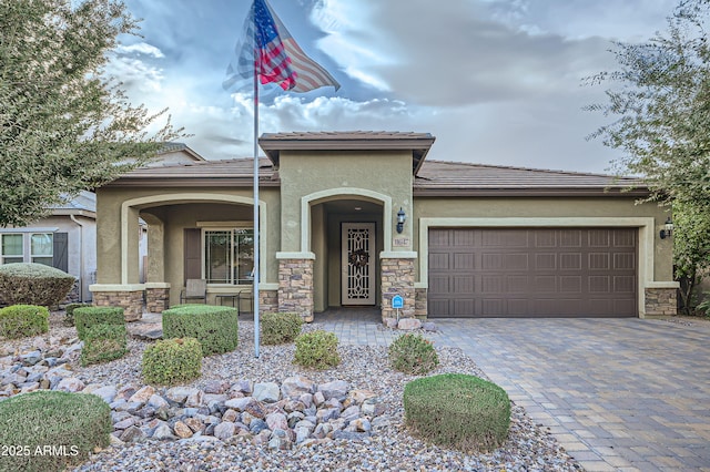 view of front of home featuring a garage and a porch