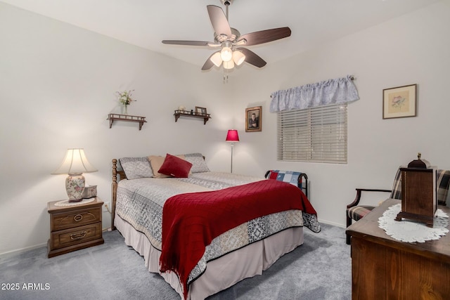 bedroom with ceiling fan and light colored carpet