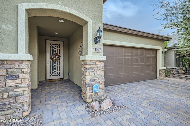 doorway to property featuring a garage