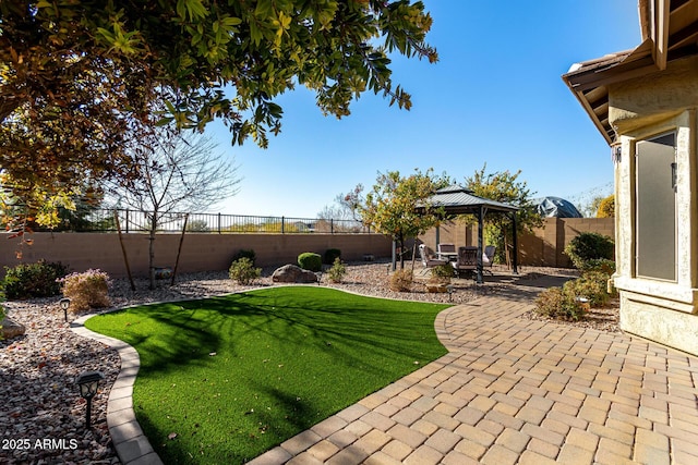 view of yard with a gazebo and a patio