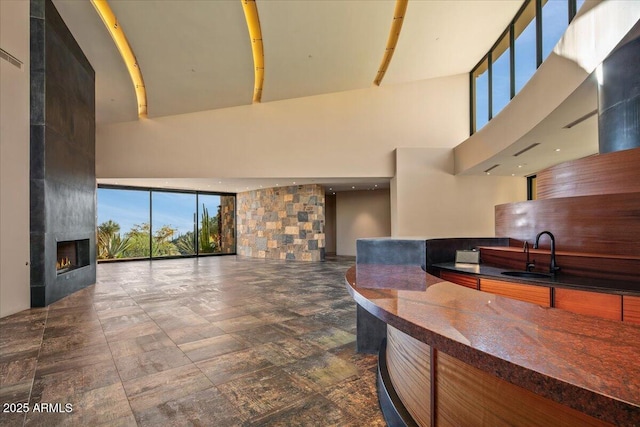 welcome area with a sink and a large fireplace