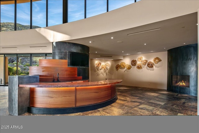 reception area with a large fireplace and a sink