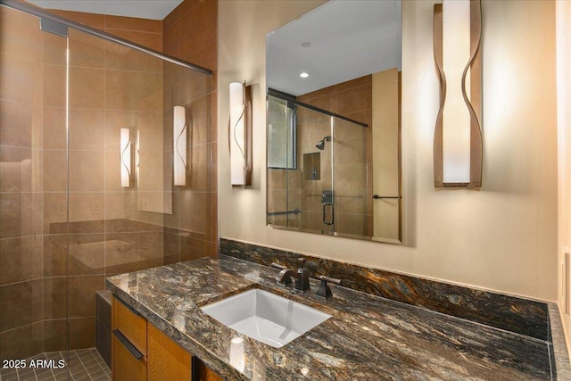 full bathroom featuring recessed lighting, vanity, and a stall shower