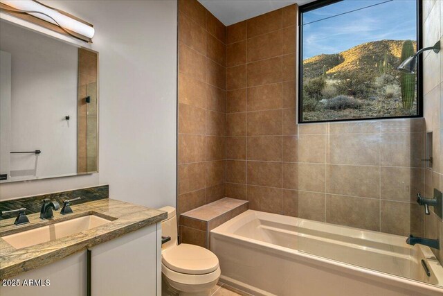 full bathroom featuring toilet, vanity, a mountain view, and  shower combination