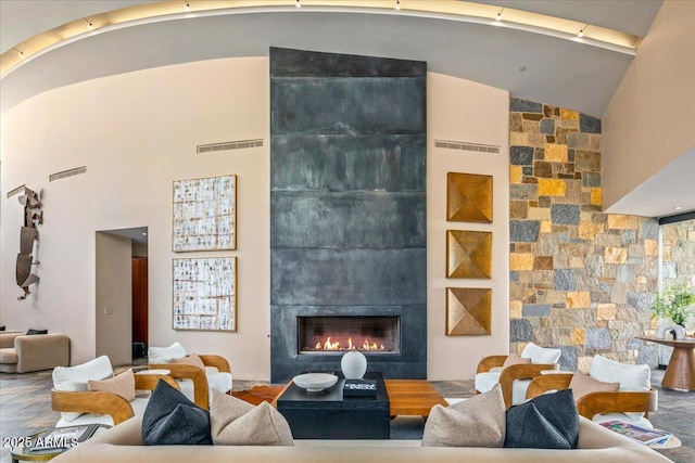 43105 N 102nd St, Scottsdale, AZ 85262 - living room with high vaulted ceiling, a fireplace, and visible vents