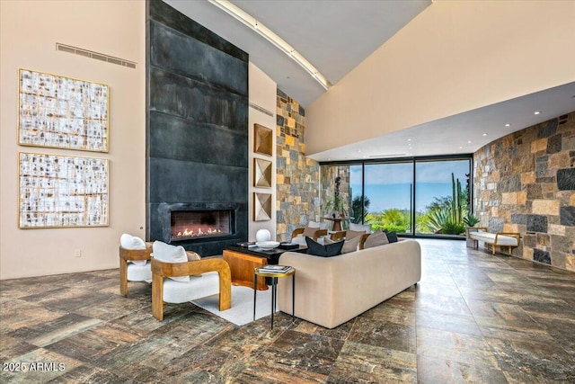 43105 N 102nd St, Scottsdale, AZ 85262 - living room with visible vents, high vaulted ceiling, and a large fireplace