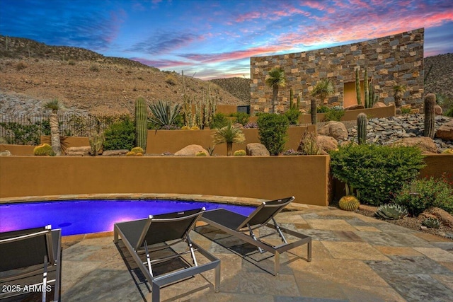43105 N 102nd St, Scottsdale, AZ 85262 - pool at dusk featuring a patio area, an outdoor pool, and fence