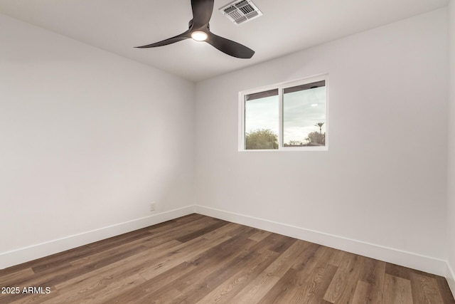 unfurnished room with hardwood / wood-style flooring and ceiling fan