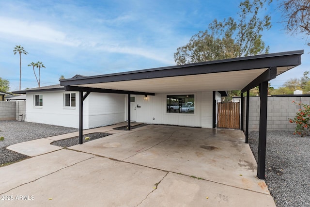 exterior space with a carport