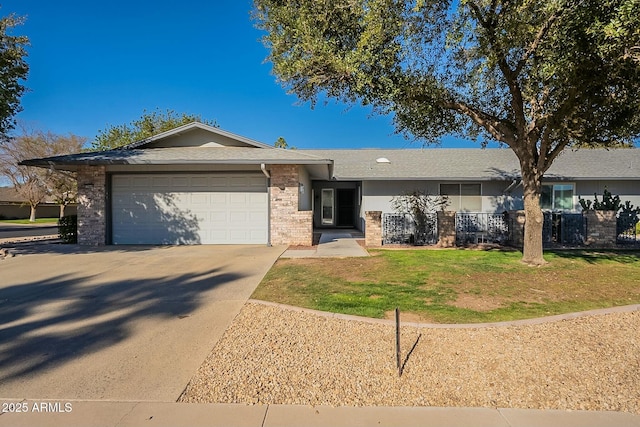 ranch-style house featuring a front lawn, brick siding, driveway, and an attached garage