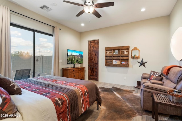 bedroom featuring access to exterior, hardwood / wood-style flooring, and ceiling fan