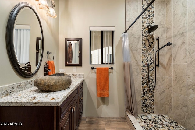 bathroom featuring vanity and a shower with shower curtain