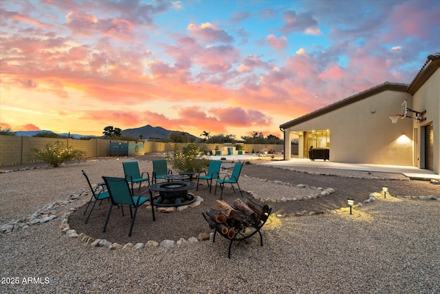 patio terrace at dusk with a fire pit