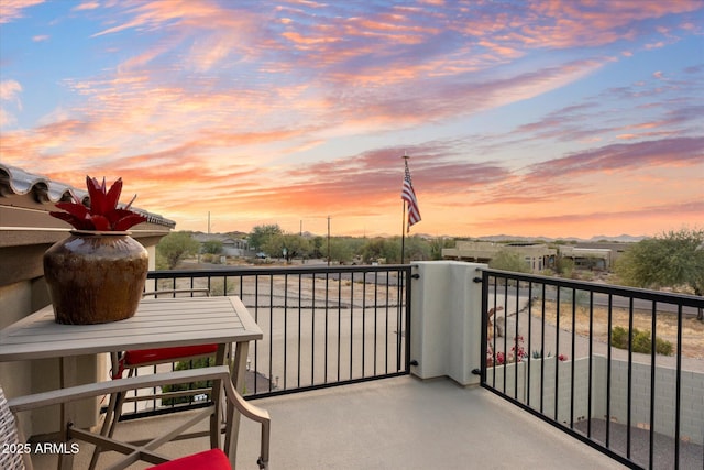 view of balcony at dusk