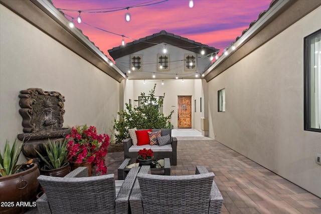 patio terrace at dusk with an outdoor hangout area