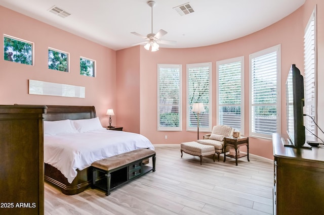 32731 N 74th Way, Scottsdale, AZ 85266 - bedroom with multiple windows, baseboards, and light wood-type flooring