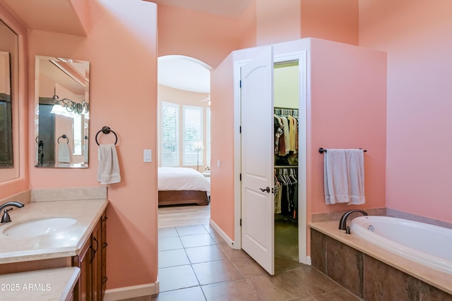 32731 N 74th Way, Scottsdale, AZ 85266 - full bath with vanity, tile patterned flooring, a garden tub, and a walk in closet