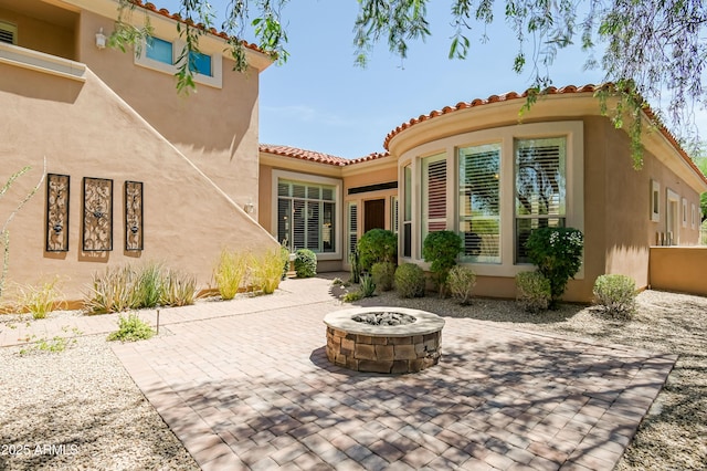 32731 N 74th Way, Scottsdale, AZ 85266 - back of house with an outdoor fire pit, a patio, stucco siding, and a tile roof