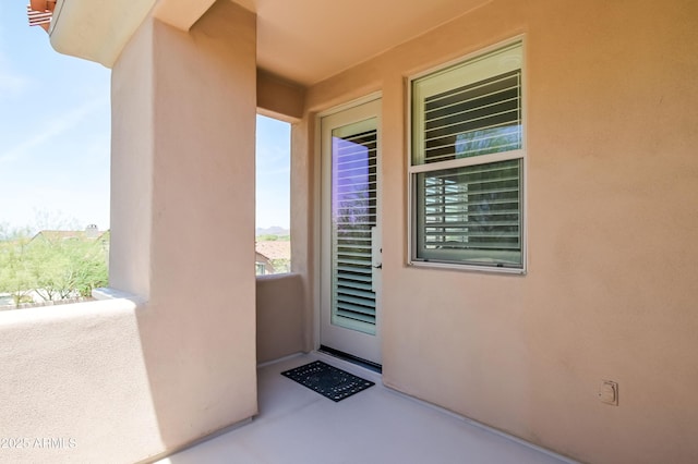 32731 N 74th Way, Scottsdale, AZ 85266 - view of exterior entry with a balcony and stucco siding